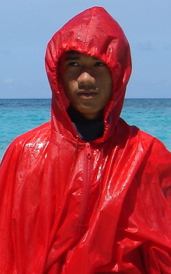 poncho cape with hood in the water on beach
